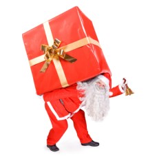 Santa Claus carries a big present